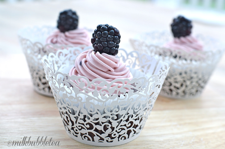 Chocolate cupcakes with blackberry butter cream frosting